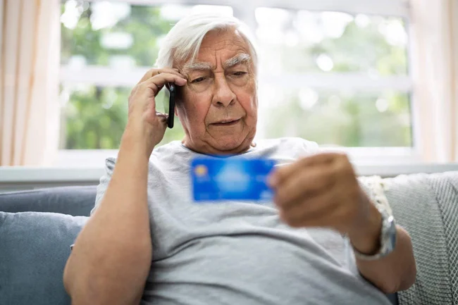 Elderly-Man-Talking-On-The-Phone.webp